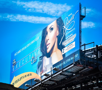large blue billboard of a lady