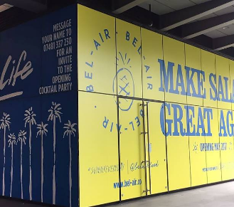 large blue billboard of a lady
